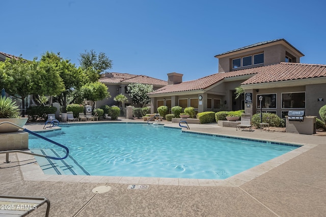 community pool with a patio