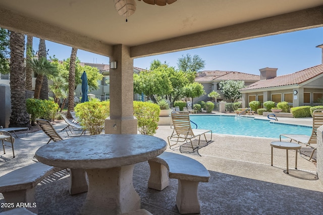 community pool featuring a patio and ceiling fan