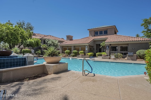 community pool with a patio