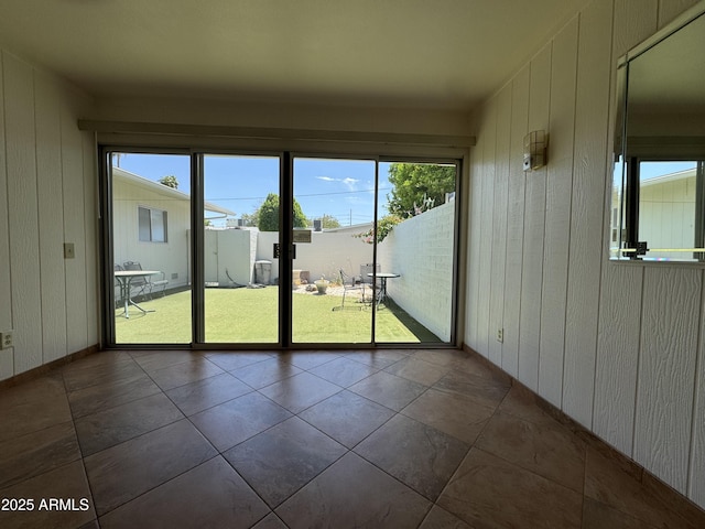 unfurnished sunroom featuring a healthy amount of sunlight