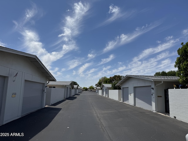 view of road with community garages