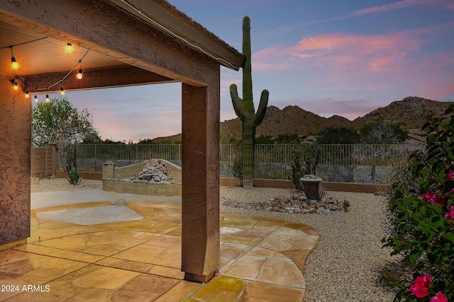 patio terrace at dusk with a mountain view