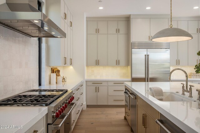 24779 N 91st St, Scottsdale, AZ 85255 - kitchen featuring wall chimney exhaust hood, high quality appliances, a sink, tasteful backsplash, and recessed lighting