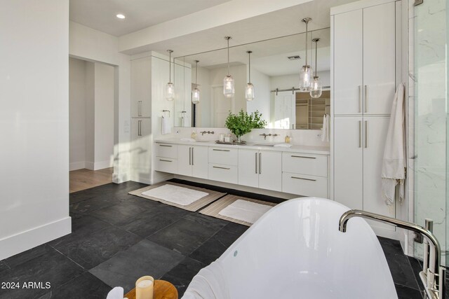 24779 N 91st St, Scottsdale, AZ 85255 - full bathroom featuring baseboards, a freestanding bath, double vanity, and recessed lighting