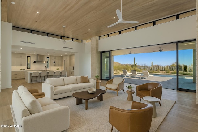 24779 N 91st St, Scottsdale, AZ 85255 - living area with a high ceiling, light wood finished floors, ceiling fan, recessed lighting, and wood ceiling
