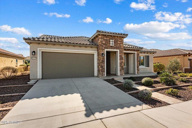 mediterranean / spanish-style house featuring a garage