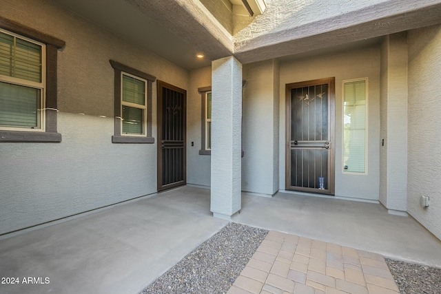 doorway to property with a patio