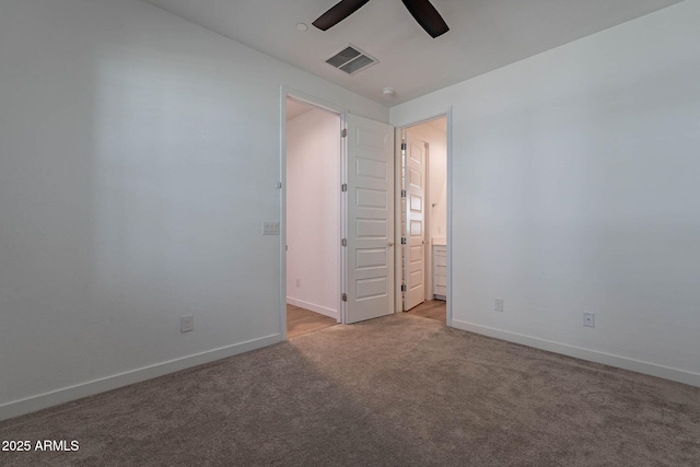 unfurnished room featuring a ceiling fan, carpet flooring, visible vents, and baseboards