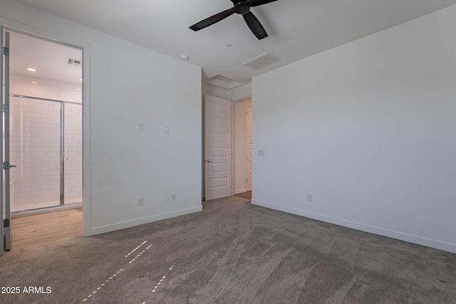 unfurnished bedroom featuring baseboards, visible vents, ensuite bath, and carpet flooring