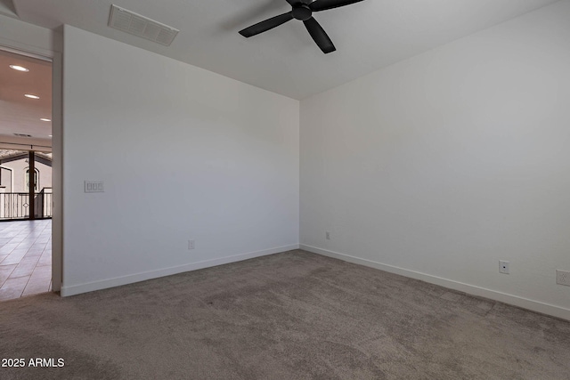 carpeted empty room with ceiling fan, recessed lighting, visible vents, and baseboards