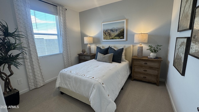 bedroom with light colored carpet