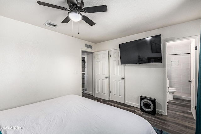325 E Harmony Ave, Mesa, AZ 85210 - bedroom featuring wood finished floors, ensuite bath, a closet, and ceiling fan