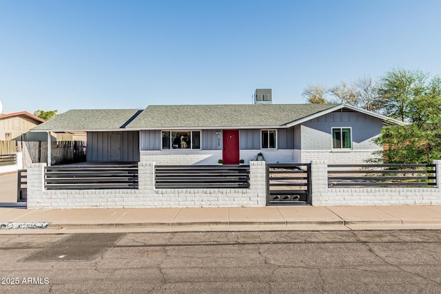325 E Harmony Ave, Mesa, AZ 85210 - ranch-style house with a fenced front yard, a shingled roof, and brick siding