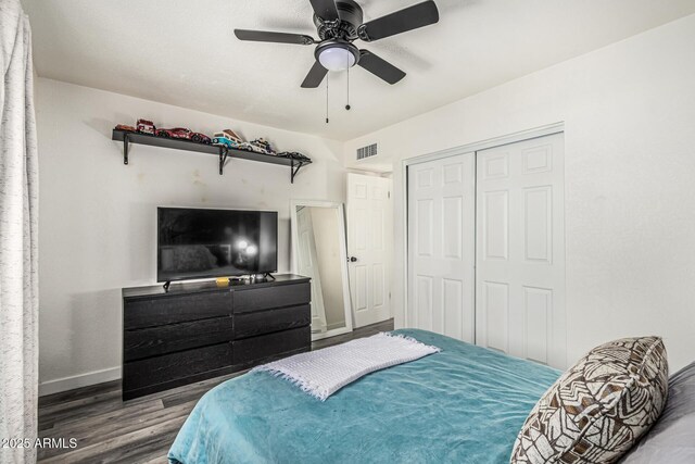 325 E Harmony Ave, Mesa, AZ 85210 - bedroom featuring wood finished floors, a closet, and ceiling fan