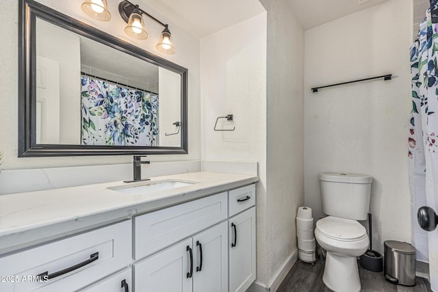 325 E Harmony Ave, Mesa, AZ 85210 - bathroom featuring wood finished floors and vanity