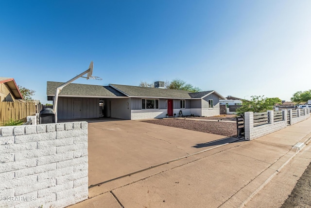 325 E Harmony Ave, Mesa, AZ 85210 - ranch-style home featuring brick siding, roof with shingles, and concrete driveway