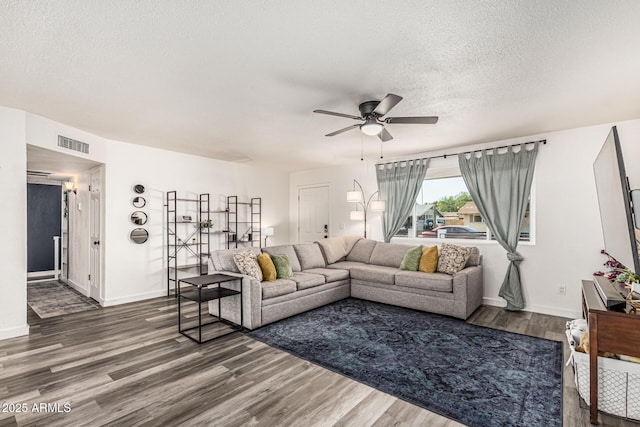 325 E Harmony Ave, Mesa, AZ 85210 - living room with ceiling fan, wood finished floors, and a textured ceiling