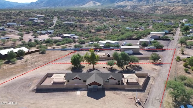 birds eye view of property featuring a mountain view