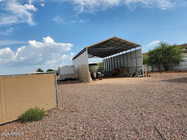 view of outbuilding featuring a carport