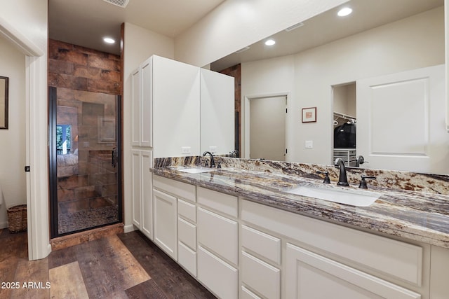 1604 W Beech Pkwy, Payson, AZ 85541 - bathroom featuring a stall shower, double vanity, wood finished floors, and recessed lighting