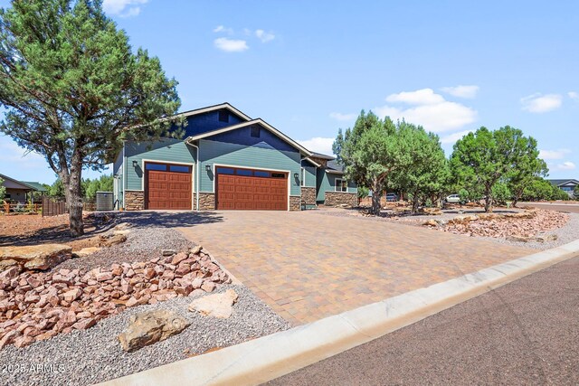 1604 W Beech Pkwy, Payson, AZ 85541 - craftsman inspired home with a garage, stone siding, fence, and decorative driveway