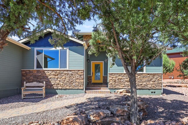 1604 W Beech Pkwy, Payson, AZ 85541 - view of front of home featuring stone siding, crawl space, and entry steps