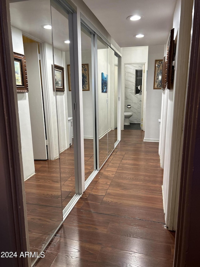 hallway featuring dark hardwood / wood-style floors