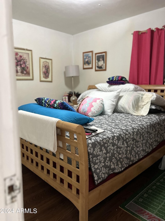 bedroom featuring dark hardwood / wood-style floors