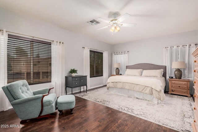 bedroom with visible vents, a ceiling fan, and wood finished floors