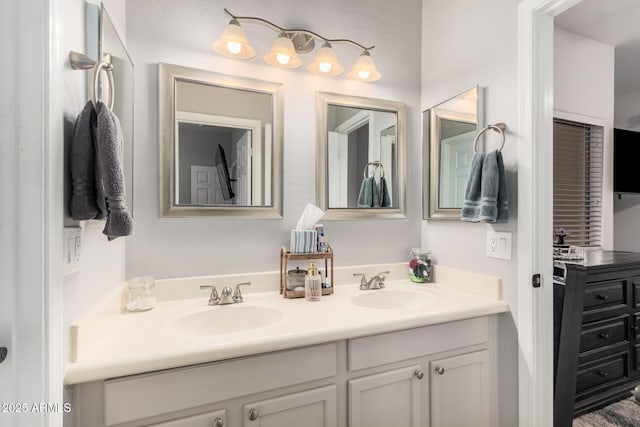 full bath featuring double vanity and a sink