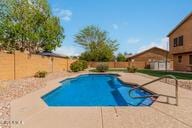 view of pool featuring a patio area, a fenced backyard, and a fenced in pool