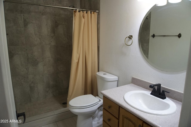 8334 N 55th Ave, Glendale, AZ 85302 - full bathroom featuring toilet, tiled shower, vanity, and tile patterned flooring