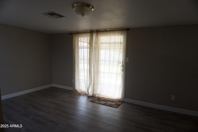 8334 N 55th Ave, Glendale, AZ 85302 - spare room featuring wood finished floors and baseboards