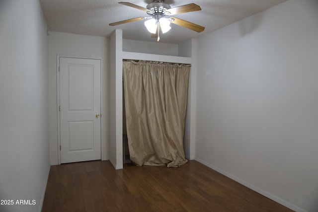 8334 N 55th Ave, Glendale, AZ 85302 - spare room featuring ceiling fan, wood finished floors, baseboards, and a textured ceiling