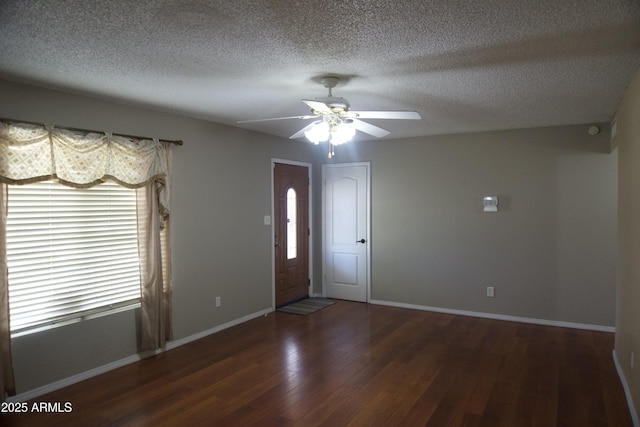 8334 N 55th Ave, Glendale, AZ 85302 - foyer entrance featuring wood finished floors, ceiling fan, baseboards, and a textured ceiling