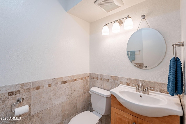 8414 N Central Ave Unit C, Phoenix, AZ 85020 - bathroom featuring toilet, vanity, and tile walls