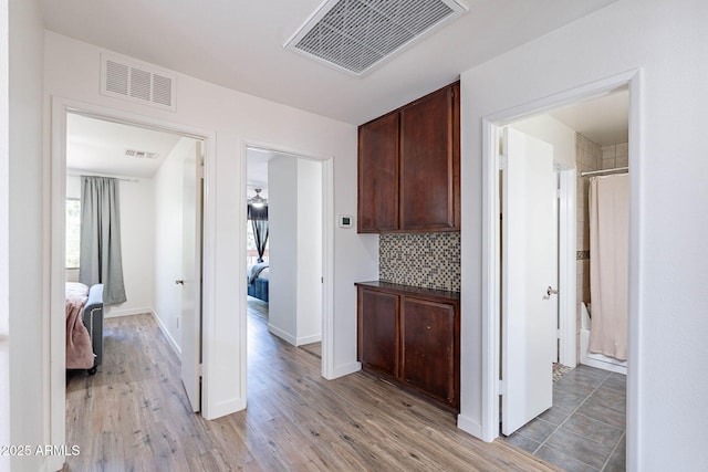 8414 N Central Ave Unit C, Phoenix, AZ 85020 - corridor with healthy amount of natural light, light wood-style flooring, and baseboards