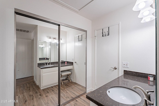 8414 N Central Ave Unit C, Phoenix, AZ 85020 - full bathroom with vanity and wood finished floors