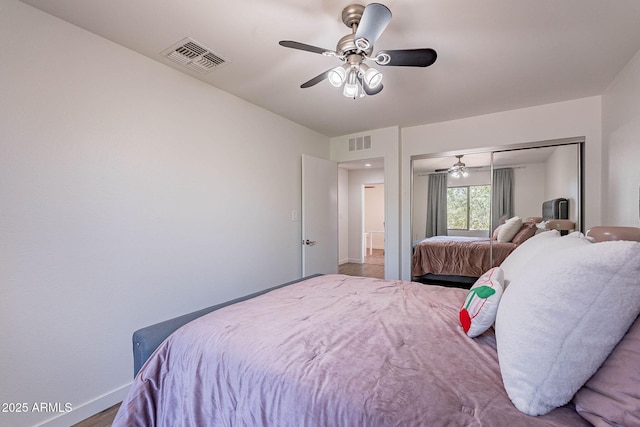 8414 N Central Ave Unit C, Phoenix, AZ 85020 - bedroom with baseboards, a closet, a ceiling fan, and wood finished floors