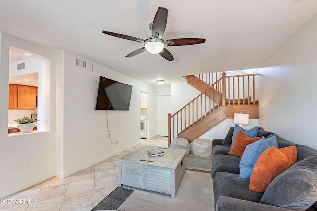 8414 N Central Ave Unit C, Phoenix, AZ 85020 - living area with ceiling fan, baseboards, and stairs