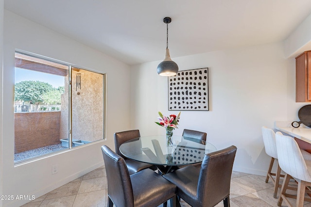 8414 N Central Ave Unit C, Phoenix, AZ 85020 - dining space with light tile patterned floors and baseboards