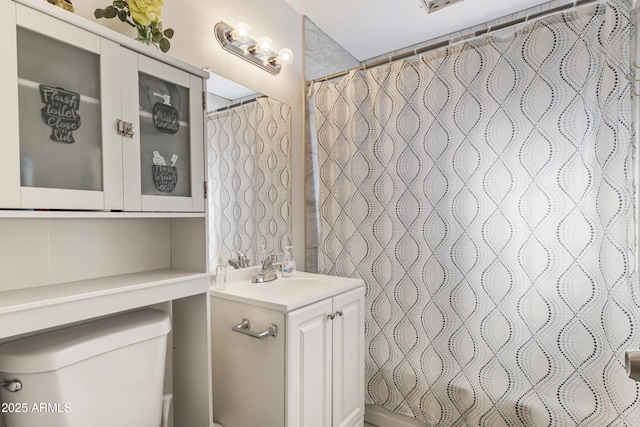 full bathroom with vanity, toilet, and shower / tub combo with curtain