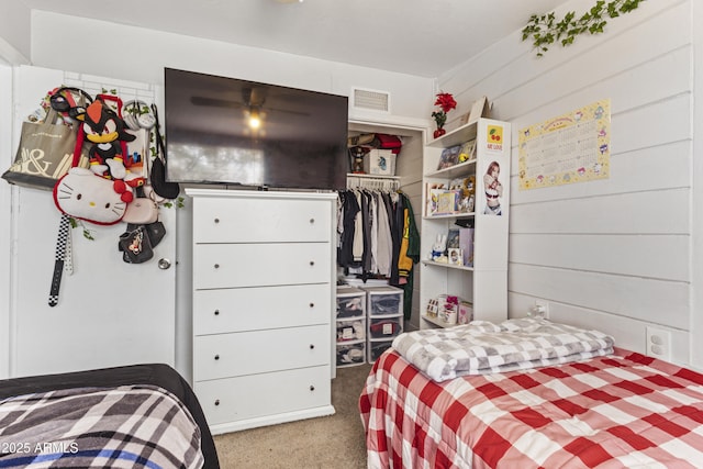 carpeted bedroom with a closet