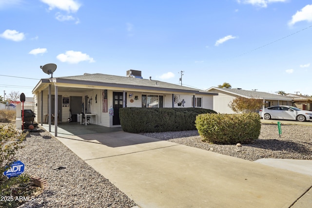 ranch-style home with a carport