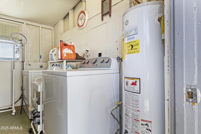 laundry room featuring gas water heater and washing machine and clothes dryer