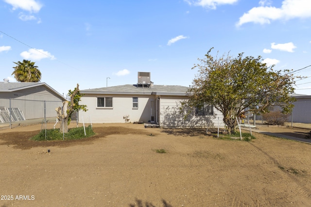 back of property featuring central AC unit