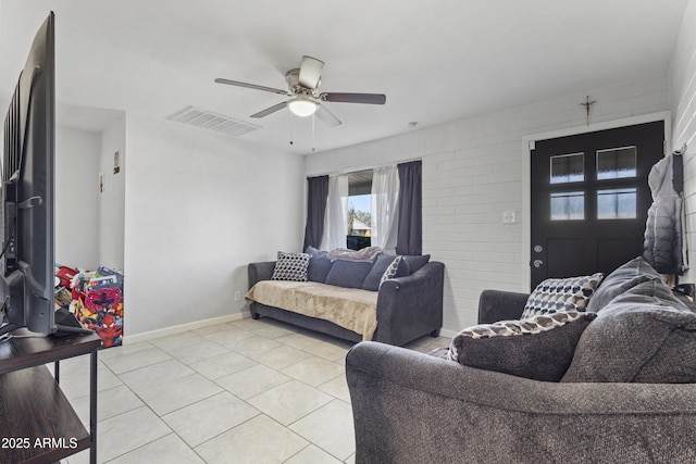 tiled living room featuring ceiling fan