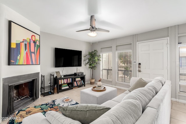 tiled living room featuring ceiling fan