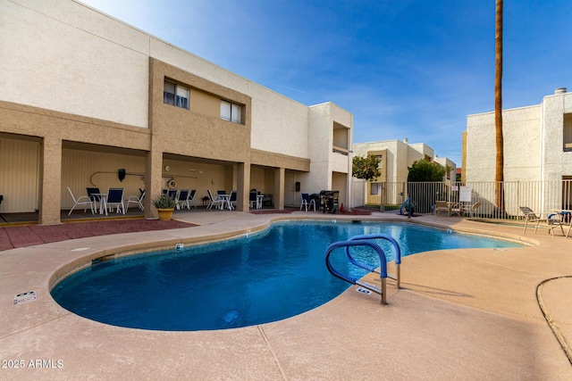 view of swimming pool featuring a patio