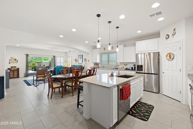 3655 N Astoria Dr, Florence, AZ 85132 - kitchen featuring appliances with stainless steel finishes, a sink, a center island with sink, recessed lighting, and open floor plan